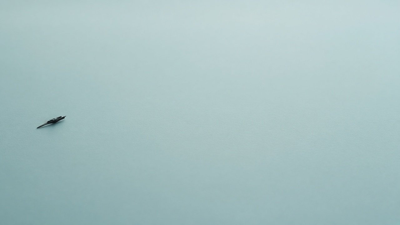 Wide mist-aqua surface with a tiny dark instrument at the far left.